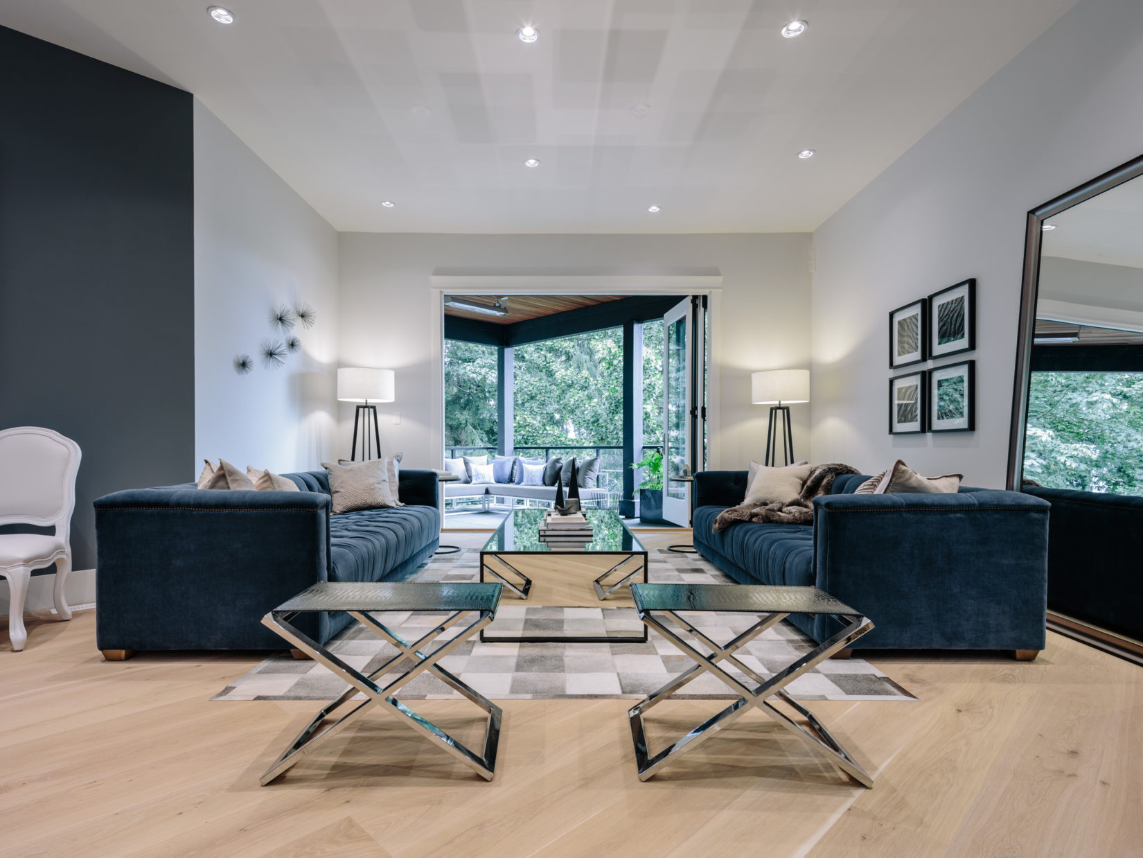 Alexandra Interiors contemporary living room with blue velvet sofas. Interior design Vancouver